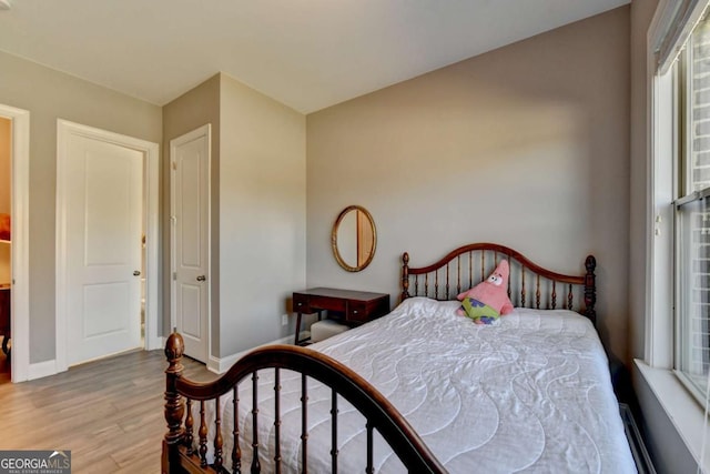 bedroom featuring hardwood / wood-style flooring