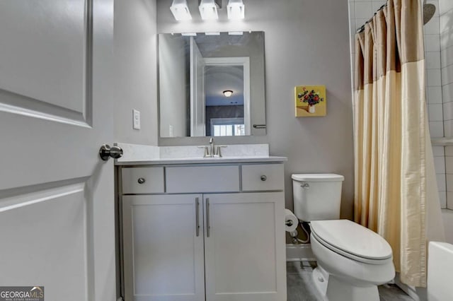 full bathroom featuring shower / bath combination with curtain, vanity, and toilet