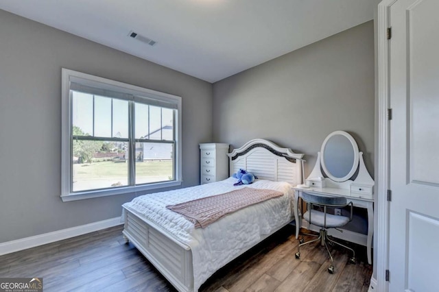 bedroom featuring dark hardwood / wood-style floors