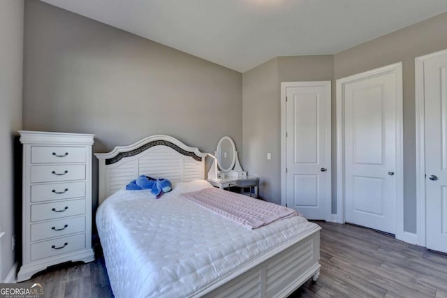 bedroom with hardwood / wood-style flooring