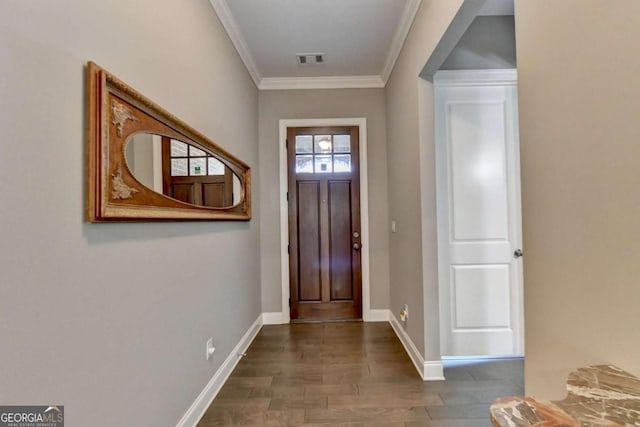 foyer with crown molding and dark hardwood / wood-style floors