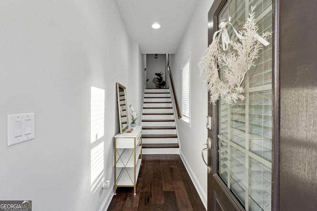 hall with dark hardwood / wood-style flooring