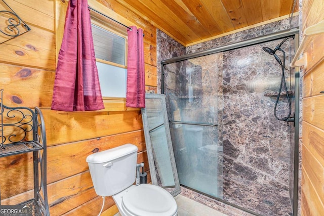 bathroom with toilet, a shower with door, wooden walls, and wooden ceiling