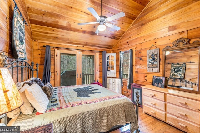 bedroom featuring access to outside, vaulted ceiling, ceiling fan, wood-type flooring, and wood ceiling