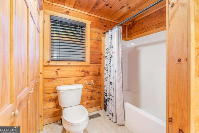 bathroom featuring toilet, tile patterned flooring, wood walls, and wooden ceiling