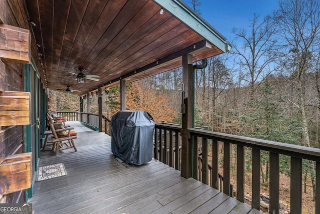 deck featuring grilling area and ceiling fan