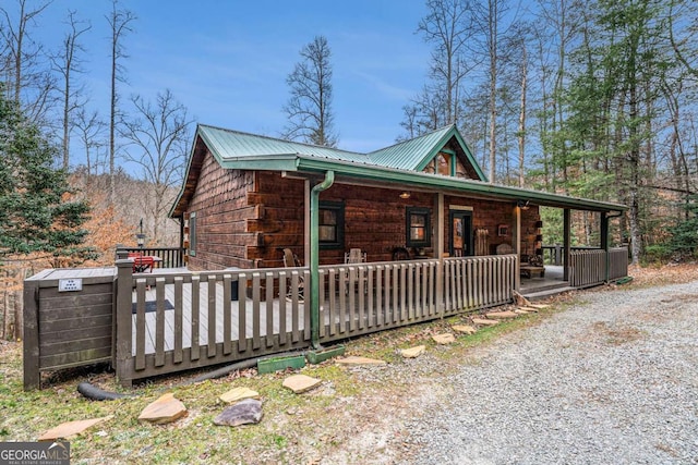 view of property exterior with a porch