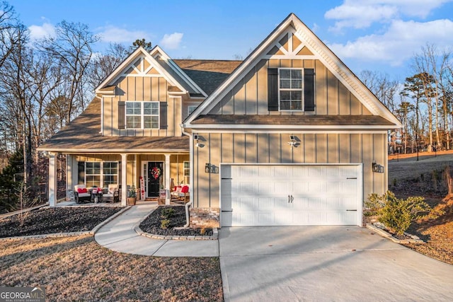 view of front of home with a porch and a garage