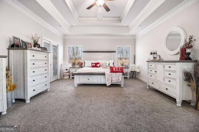 bedroom featuring a raised ceiling, ceiling fan, and crown molding