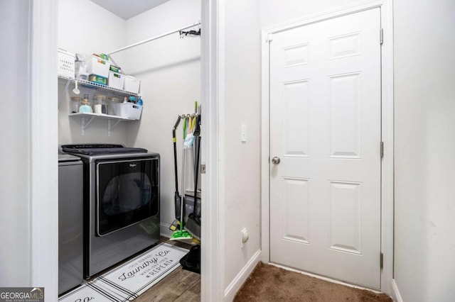 clothes washing area with separate washer and dryer