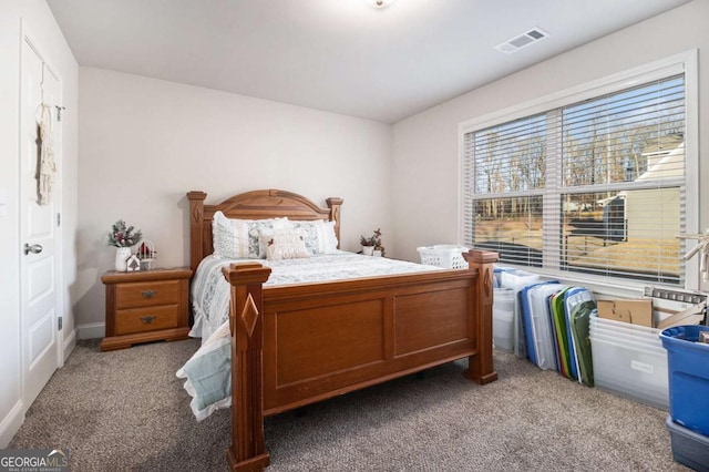 bedroom with light colored carpet