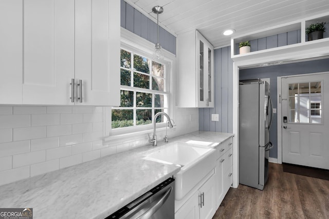 kitchen featuring white cabinetry, pendant lighting, and appliances with stainless steel finishes