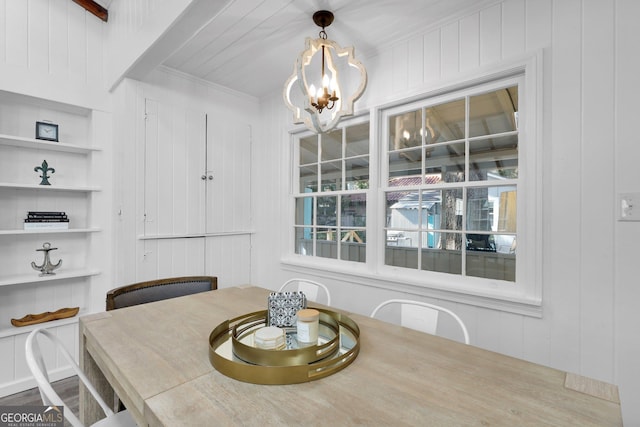 dining area featuring an inviting chandelier