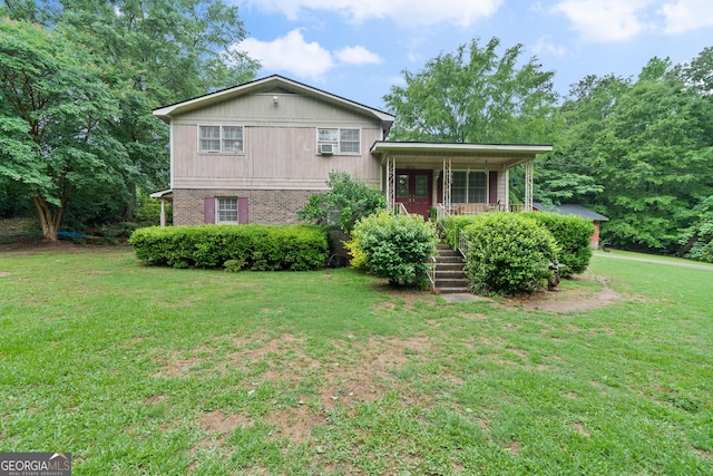 split level home featuring a front yard and a porch