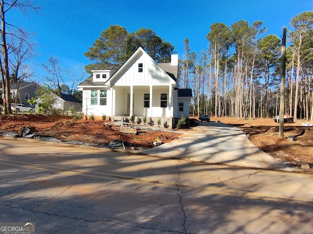 modern inspired farmhouse with a porch