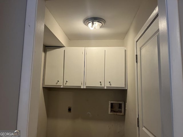 washroom featuring washer hookup, cabinets, and hookup for an electric dryer