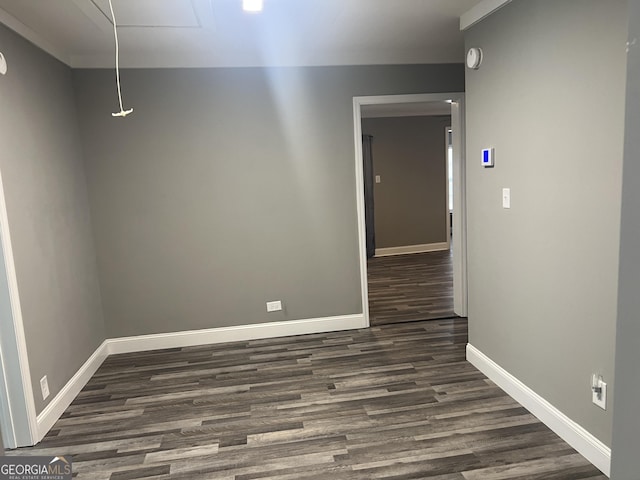 spare room with dark hardwood / wood-style floors