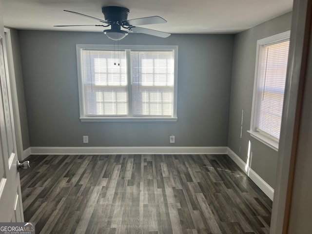 unfurnished room featuring ceiling fan and dark wood-type flooring