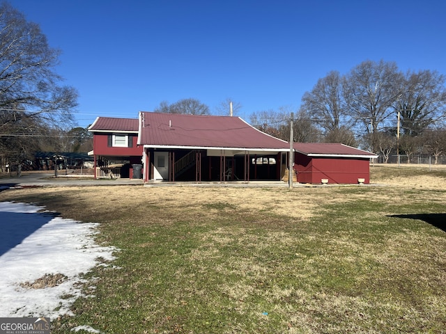 view of outbuilding featuring a lawn