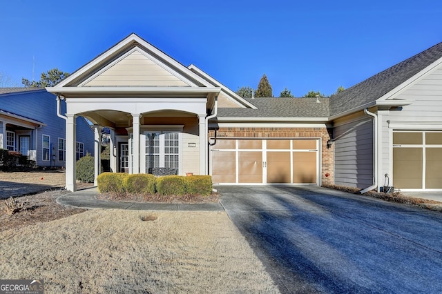 view of front of property featuring a garage