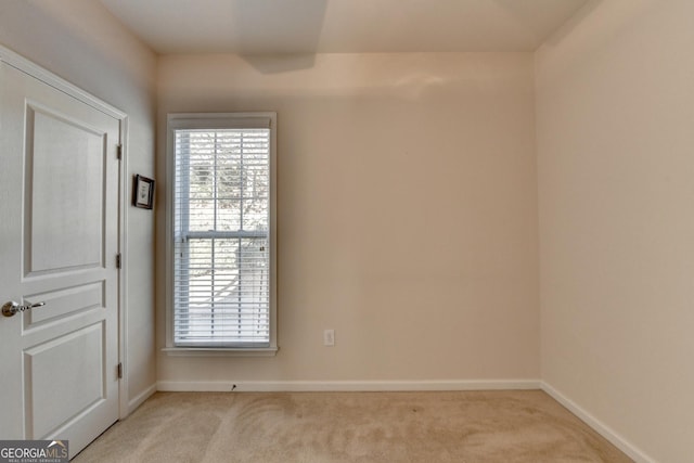 empty room featuring light colored carpet