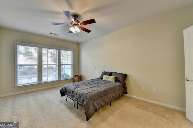 carpeted bedroom with ceiling fan