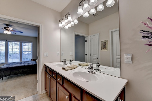 bathroom with tile patterned flooring, ceiling fan, and vanity