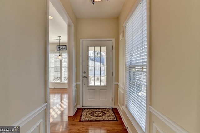 doorway with dark hardwood / wood-style floors