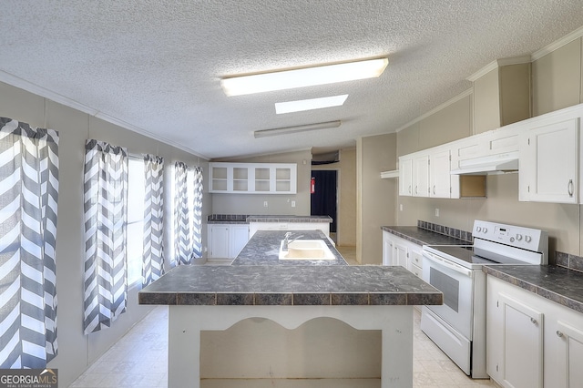 kitchen featuring white cabinets, white electric range oven, a center island, and a textured ceiling