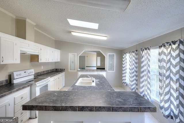 kitchen with a textured ceiling, a kitchen island, white range with electric stovetop, white cabinets, and sink