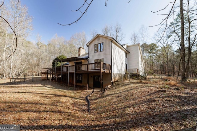 back of property featuring a deck