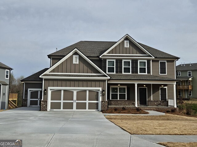 craftsman house featuring covered porch and a garage