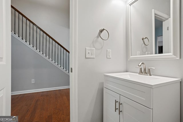 bathroom featuring vanity and hardwood / wood-style flooring