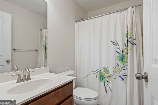 bathroom with vanity and toilet