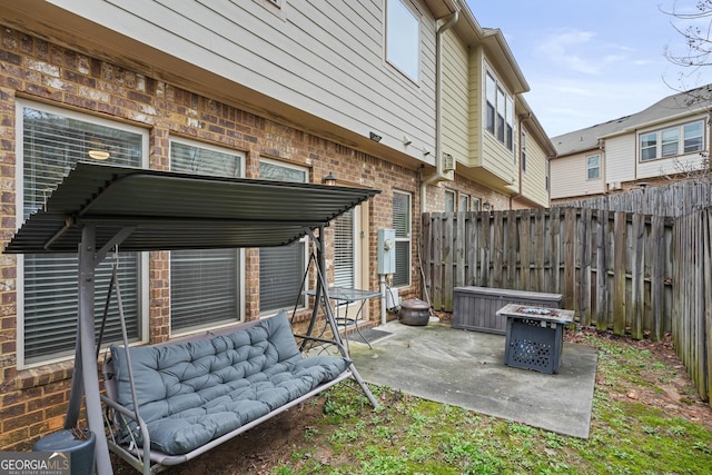 view of patio / terrace featuring an outdoor living space with a fire pit