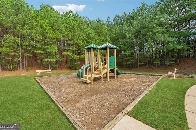 view of playground featuring a lawn