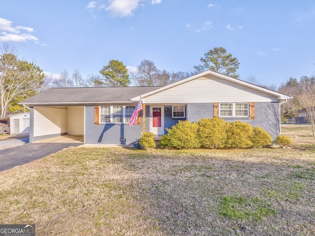 single story home featuring a carport and a front lawn