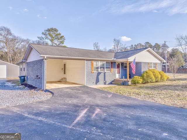 ranch-style home featuring a carport