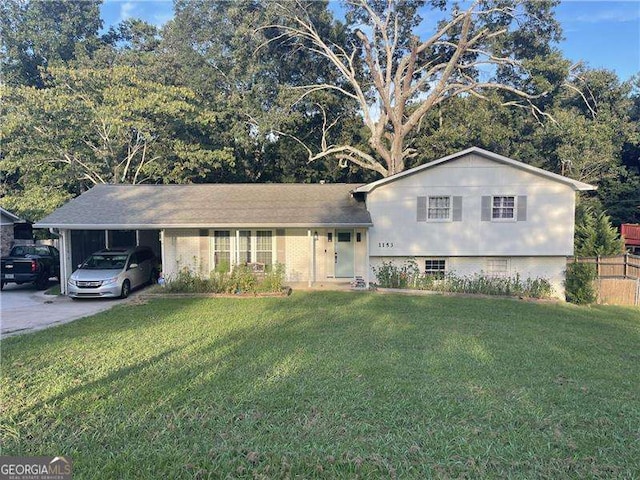 split level home with a front yard and a carport