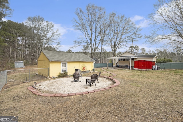 view of yard featuring a patio area and an outdoor fire pit