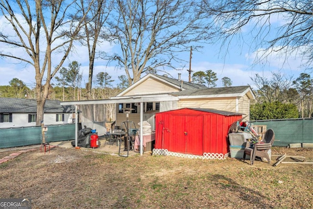 view of outbuilding featuring a yard