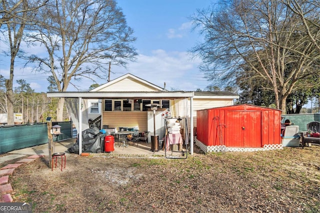 back of property with a storage unit