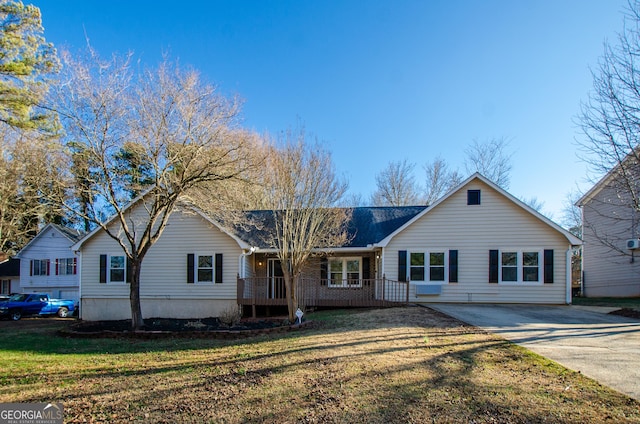 ranch-style home with a front yard