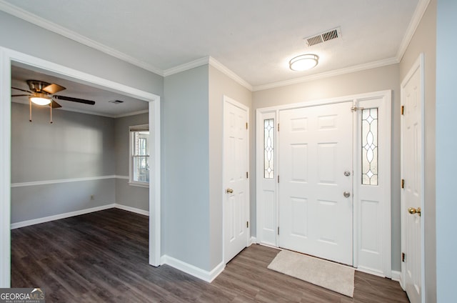 entryway featuring ornamental molding, ceiling fan, and dark hardwood / wood-style floors