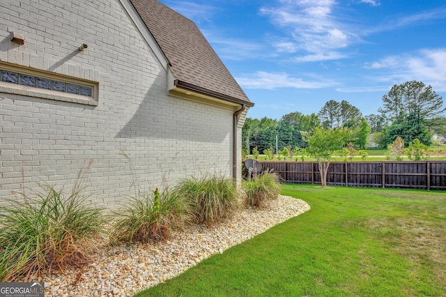 view of home's exterior featuring a lawn