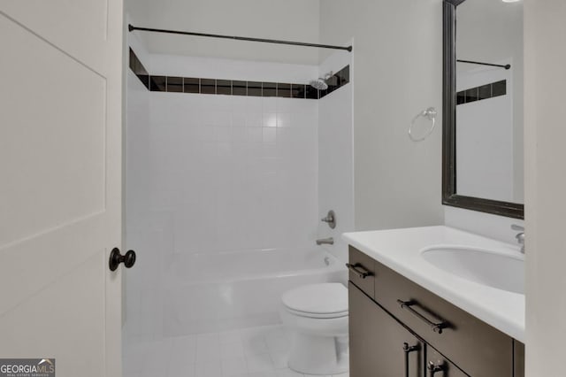 full bathroom with toilet, tiled shower / bath combo, tile patterned flooring, and vanity