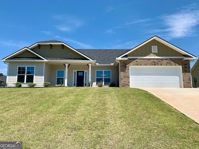 craftsman house featuring a garage and a front lawn