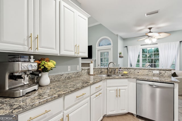 kitchen with kitchen peninsula, white cabinets, dishwasher, and sink