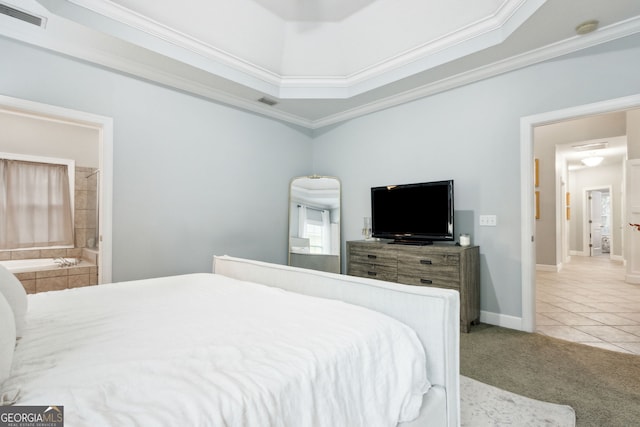 bedroom featuring crown molding, ensuite bathroom, a raised ceiling, and carpet flooring