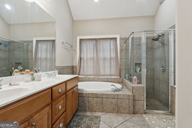 bathroom with plus walk in shower, tile patterned floors, and vanity